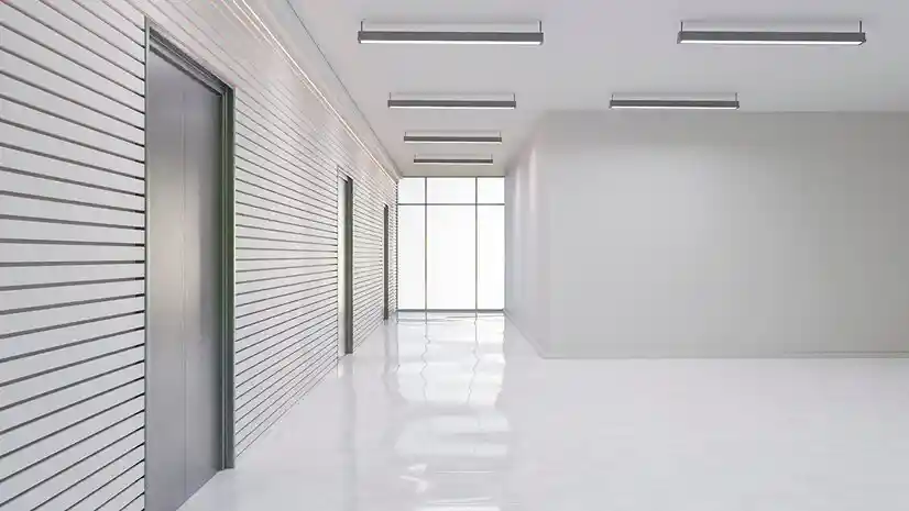 Modern office corridor with false ceiling lights